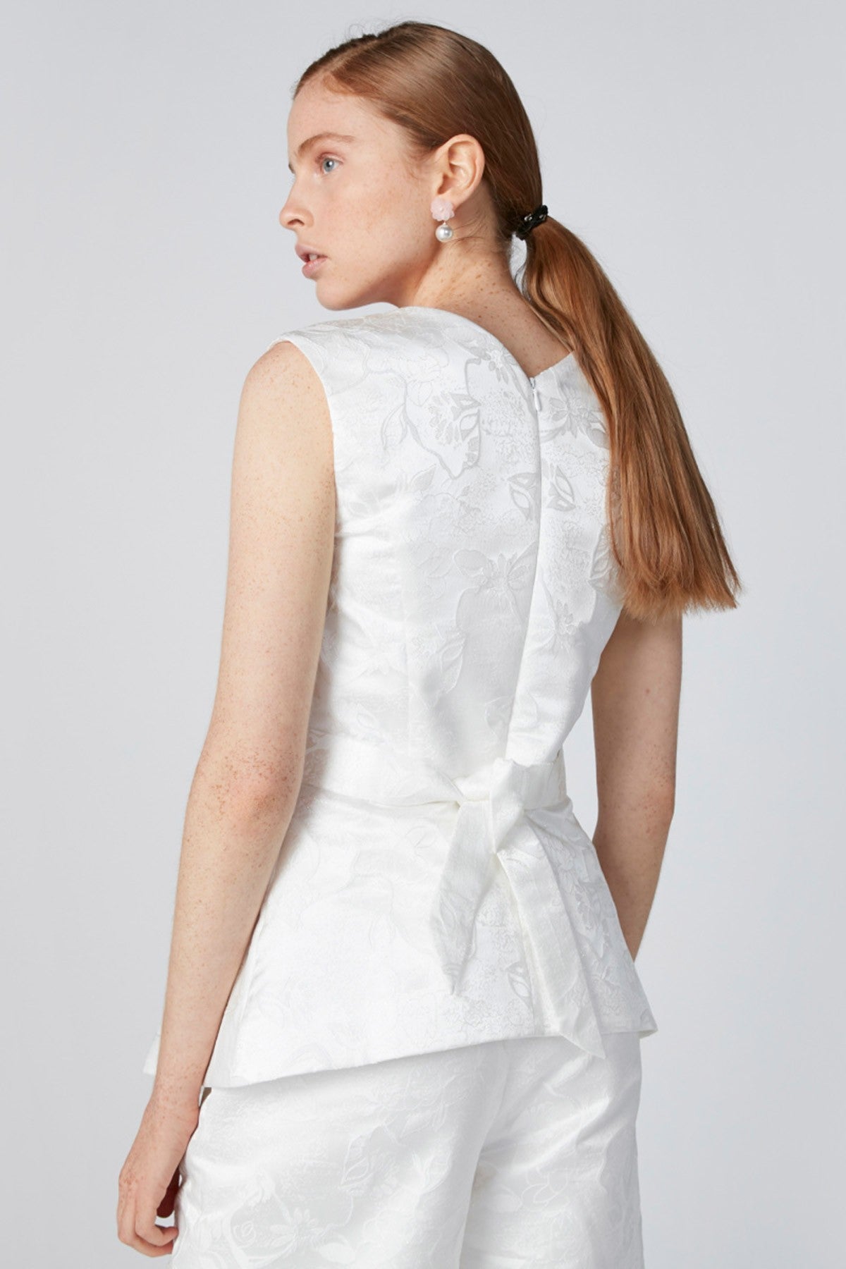 Sleeveless Textured Top with Flower Applique Detail and Tie Ups